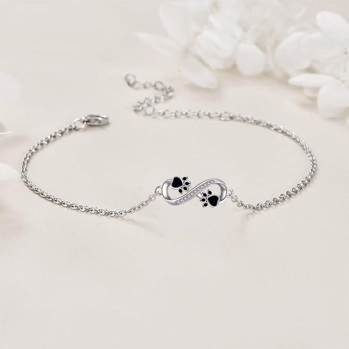 Cubic Zirconia Bracelet Featuring Paw Charm and Infinity Symbol