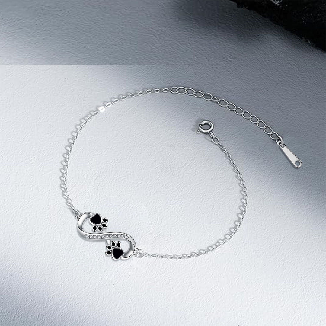 Cubic Zirconia Bracelet Featuring Paw Charm and Infinity Symbol