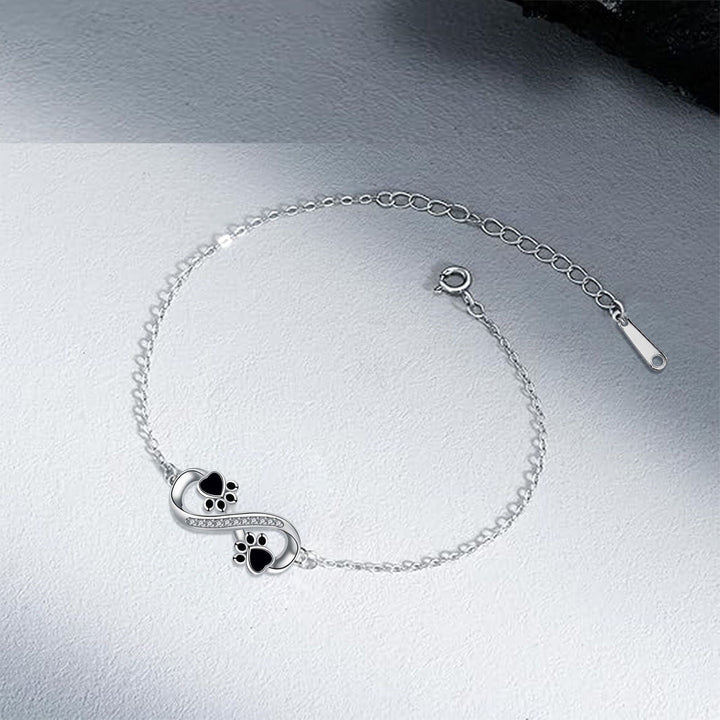 Cubic Zirconia Bracelet Featuring Paw Charm and Infinity Symbol